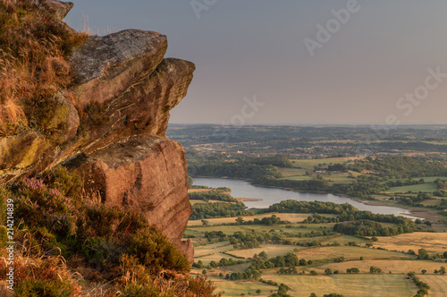 Golden hour as the sunset lights the heather and rocks at the Roaches, Staffordshire in the Peak District National Park.  photo