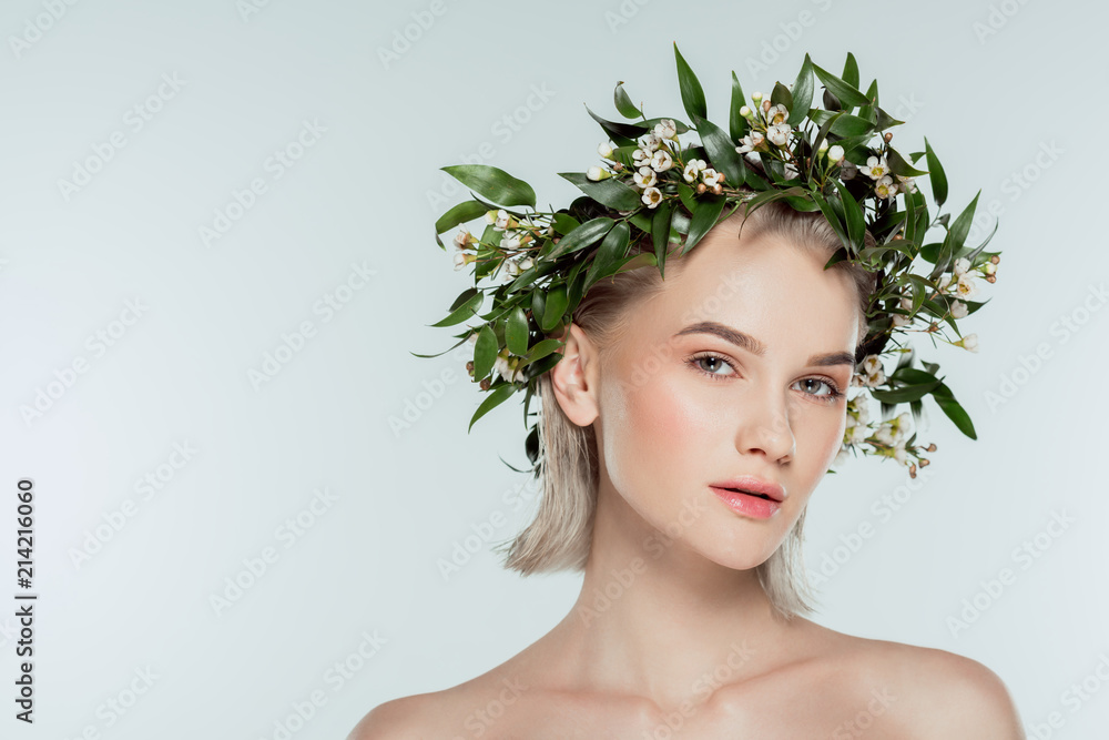 attractive blonde girl in floral wreath, isolated on grey attractive blonde girl in floral wreath, isolated on grey