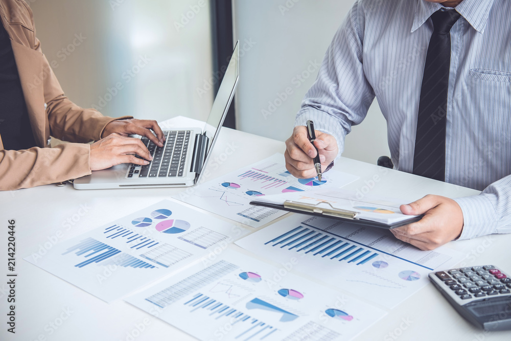 Business people discussion, Executive team discussing the charts and graphs working in business strategy and financial plan to investment profit Business people discussion, Executive team discussing the charts and graphs working in business strategy and financial plan to investment profit