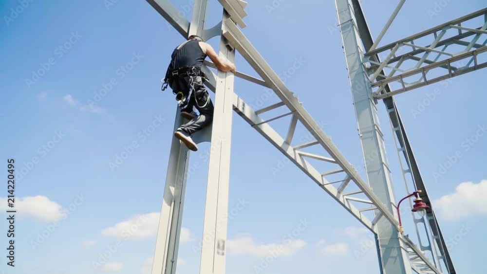 Guy climbs on the bridge for a jump Guy climbs on the bridge for a jump