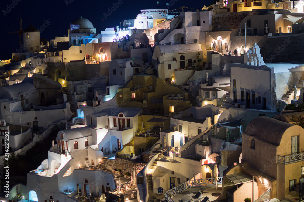 Whitewashed Houses on Cliffs with Sea View at Night in Oia, Santorini, Cyclades, Greece