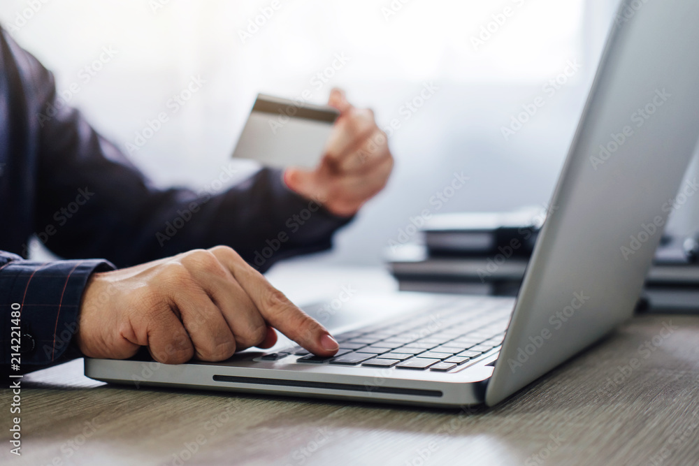 Man typing laptop for online shopping and pay by credit card, Online payment and shopping concept Man typing laptop for online shopping and pay by credit card, Online payment and shopping concept