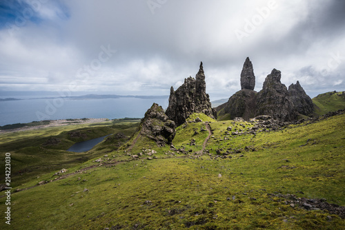 Old Man of Storr on the Isle of Skye with a sea in the background during a cloudy summer day in Scotland