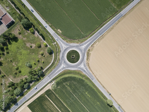 aerial view of four roads with roundabout surrounded with agro fields, Italy photo