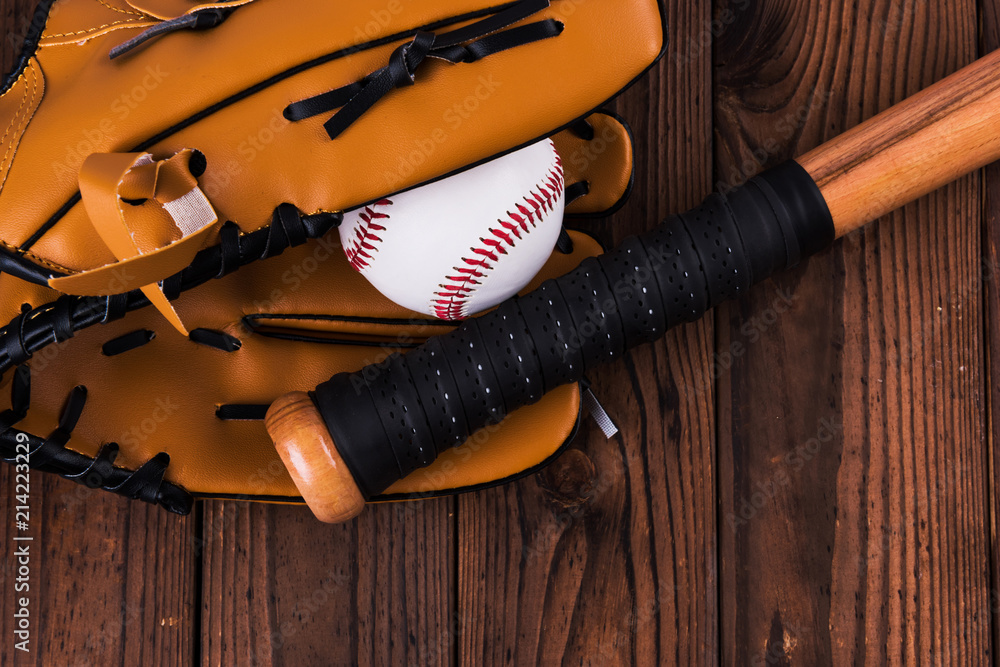 Top view of baseball bat, ball and glove wooden table. Stock Photo | Adobe  Stock
