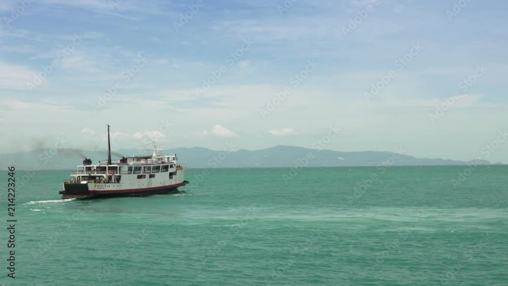 Small ferry boat on bright turquoise ocean Small ferry boat on bright turquoise ocean