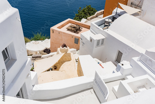Tiny little white houses and hotels in the Oia village at Santorini, Greece. © zlatamarka
