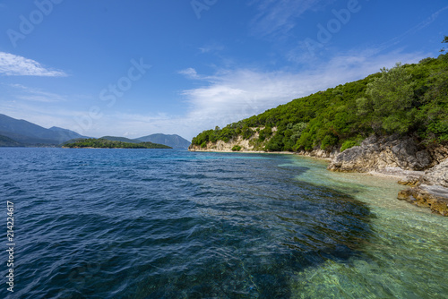 Fototapeta Naklejka Na Ścianę i Meble -  Desimi Beach Golf and nearby Island with clear water in Greece