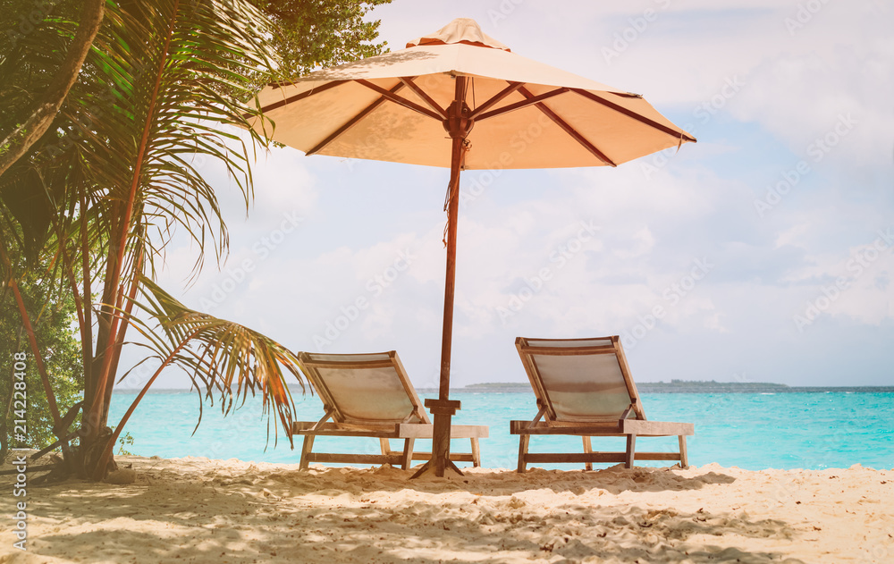 Beach chairs on the tropical beach
