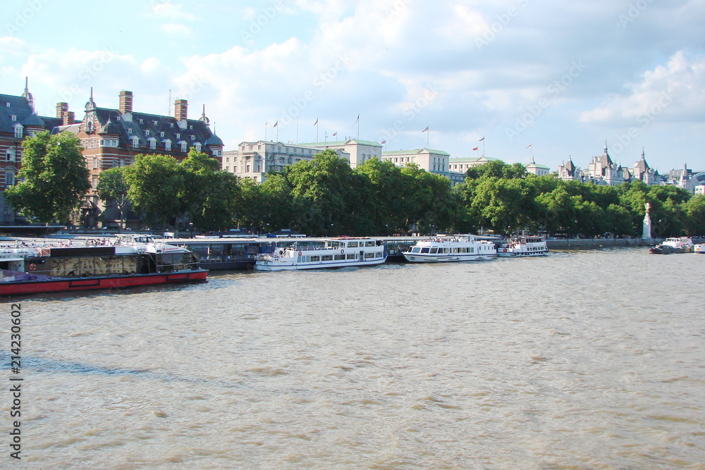 Landscape of the water surface of the River Thames against the background of a cloudy blue sky. Landscape of the water surface of the River Thames against the background of a cloudy blue sky.