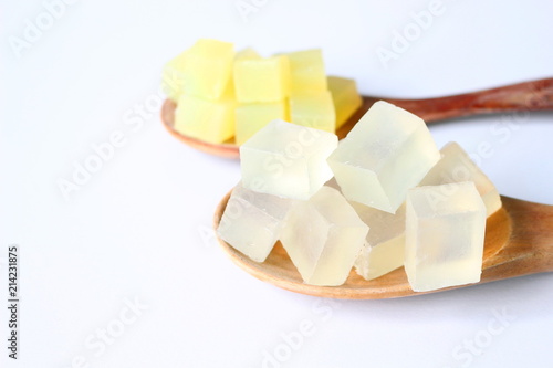 Foto Close up of sliced transparent glycerin soap bases on white background