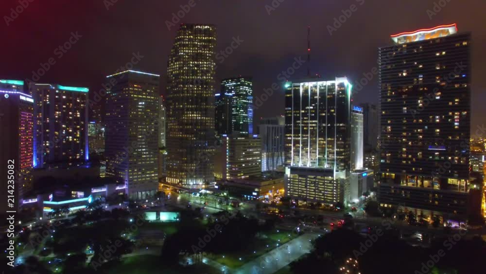 MIAMI - FEBRUARY 2016: City skyline at night from the air. The city attracts 20 million people every year MIAMI - FEBRUARY 2016: City skyline at night from the air. The city attracts 20 million people every year