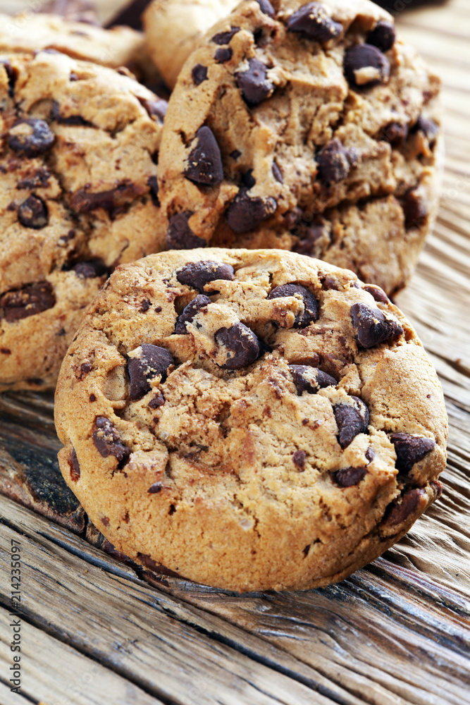 Chocolate cookies on table. Chocolate chip cookies shot with chocolate Chocolate cookies on table. Chocolate chip cookies shot with chocolate