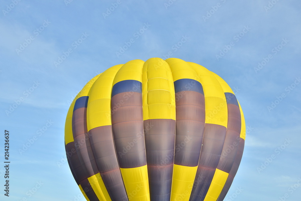 Fototapeta premium Close up of a colorful air balloon in blue sky.