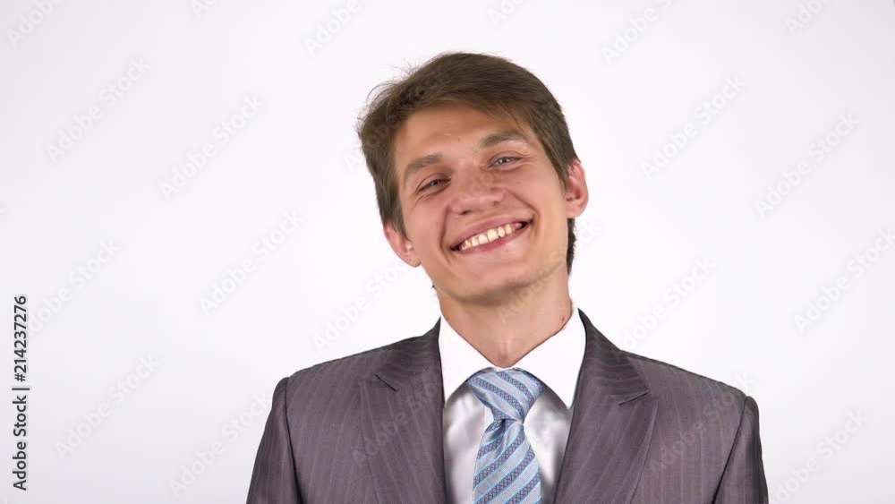 portrait of a young man. Smiling looking at the camera. portrait of a young man. Smiling looking at the camera.