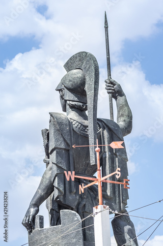 Sculpture of a warrior with a weather vane on the roof of the Circulo de Bellas Artes in Madrid, Spain. Summer of 2018.