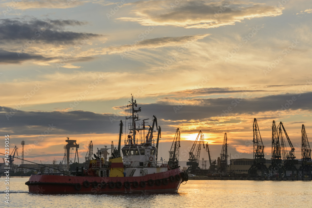 Tug boat entering the harbor with big cargo boat. Tug boat entering the harbor with big cargo boat.