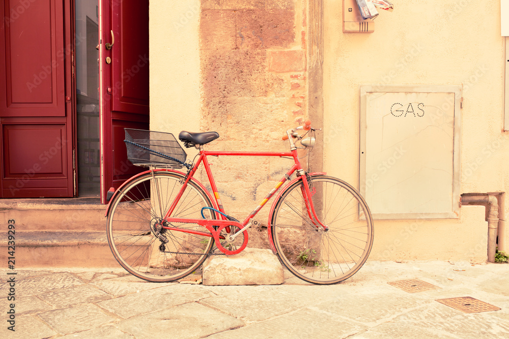Retro bike parked in an old street in Italy