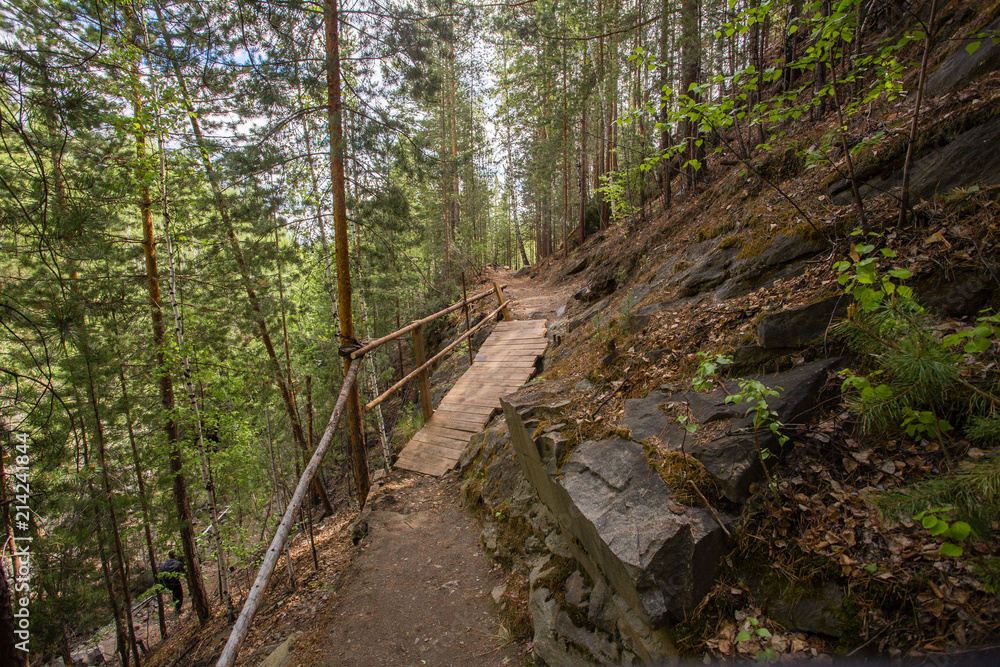 Fototapeta premium Abandoned ore mica mine quarry open pit in forest