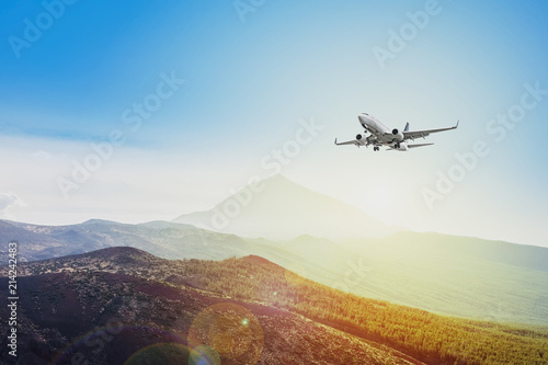 airplane flying on sunset sky background - travel concept 