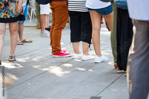 Group of people in street waiting from low perspective