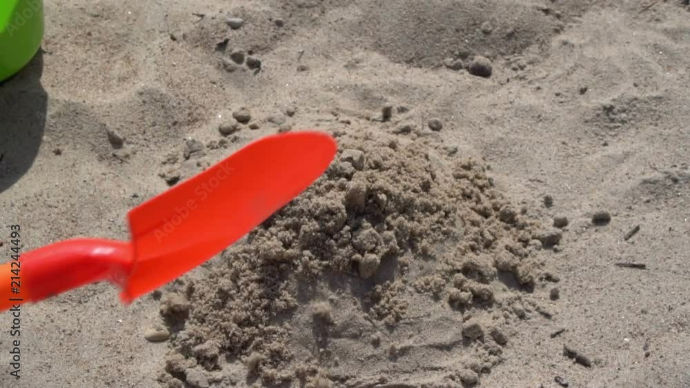 Child playing with sand on the beach HD Child playing with sand on the beach HD