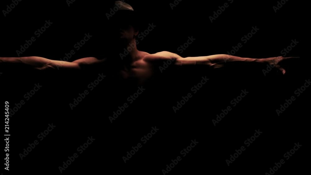 Silhouette of a man dancing in the dark Silhouette of a man dancing in the dark