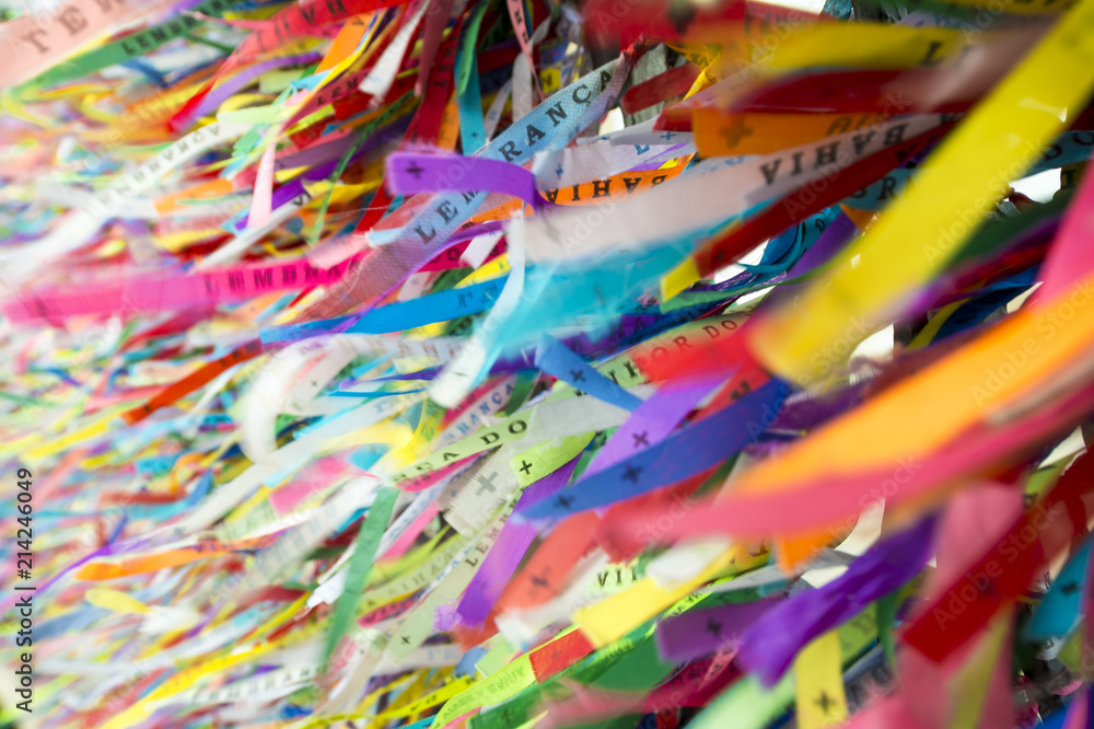 Wall of wish ribbons blowing in the wind at the famous Nosso Senhor do Bonfim da Bahia church in Salvador Bahia Brazil. Wall of wish ribbons blowing in the wind at the famous Nosso Senhor do Bonfim da Bahia church in Salvador Bahia Brazil.