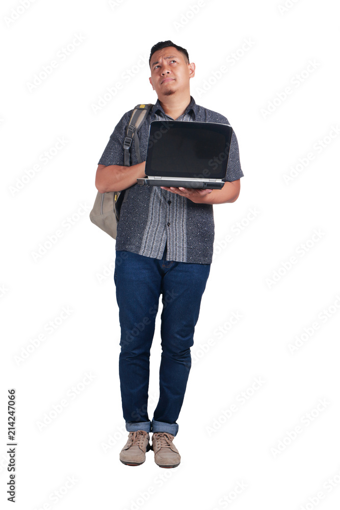 Young Asian Student With Laptop. Thinking Gesture Young Asian Student With Laptop. Thinking Gesture