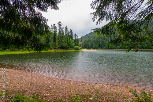 ripples on the surface of the water of the picturesque Lake Synevir at the top of the forest. Carpathians. Ukraine photo