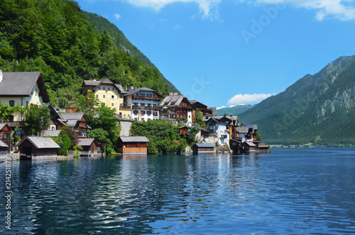 Picturesque view of small resort town near mountains on riverside