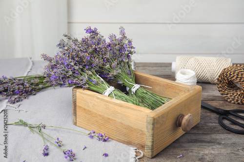 Fototapeta Naklejka Na Ścianę i Meble -  Composition with blooming lavender flowers on table