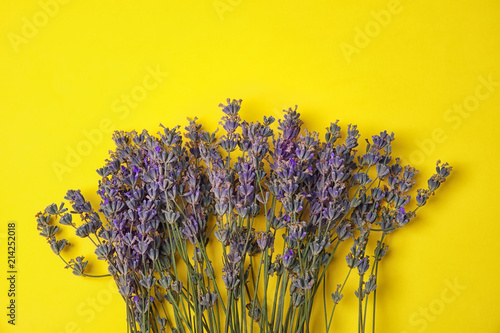 Fototapeta Naklejka Na Ścianę i Meble -  Lavender flowers on color background, top view