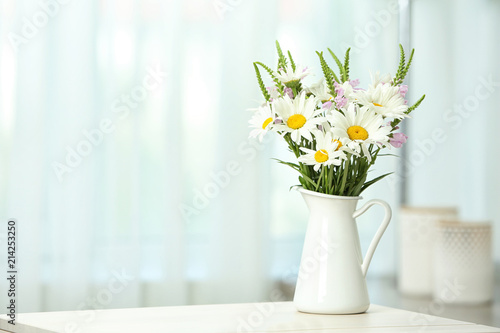 Wallpaper Mural Vase with wild flowers on table against blurred background Torontodigital.ca