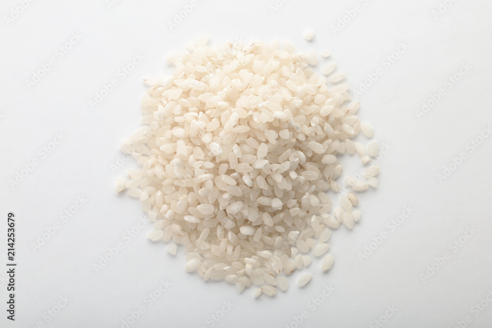 Raw rice on white background. Healthy grains and cereals Raw rice on white background. Healthy grains and cereals