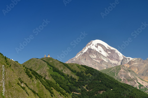 The Tsminda Sameba church and Kazbeg peak, Stepantsminda, Georgian.