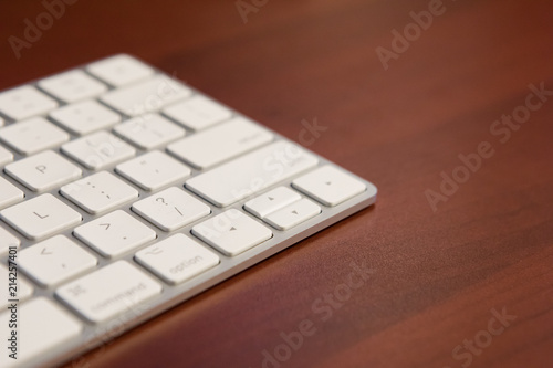 A keyboard on an office desk