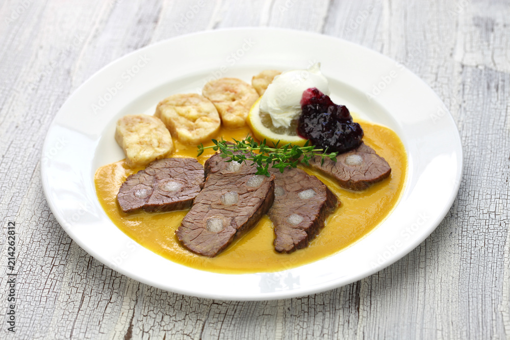 svickova na smetane ( beef in sour cream sauce) served with knedlik (bread dumpling), traditional Czech cuisine
