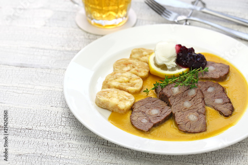 svickova na smetane ( beef in sour cream sauce) served with knedlik (bread dumpling), traditional Czech cuisine