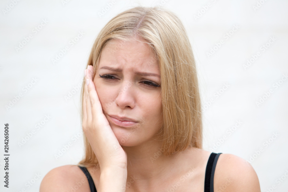 Fototapeta premium Woman with toothache outside