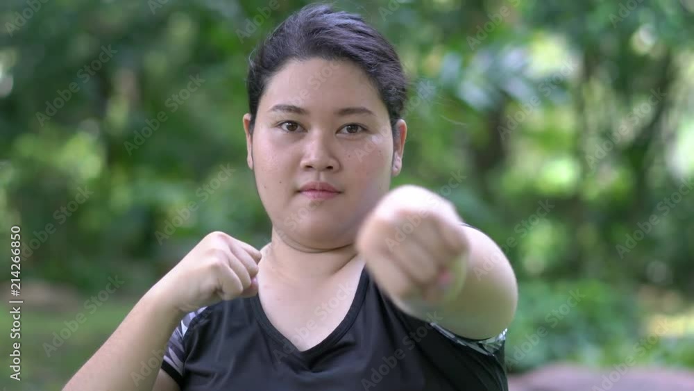 Fat women are exercising with boxing. Concept of sport, lifestyle, fitness and health. Fat women are exercising with boxing. Concept of sport, lifestyle, fitness and health.