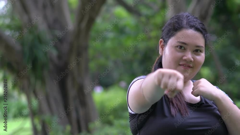 Fat women are exercising with boxing. Concept of sport, lifestyle, fitness and health. Fat women are exercising with boxing. Concept of sport, lifestyle, fitness and health.