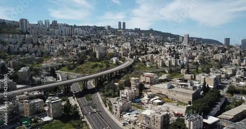 Aerial footage of Haifa City down town in summer time, with a beautiful Modern glass building. photo