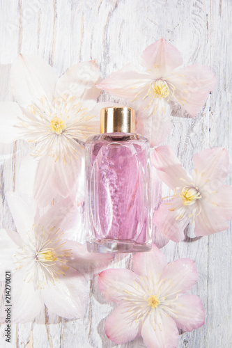 Perfume bottles and white flowers
