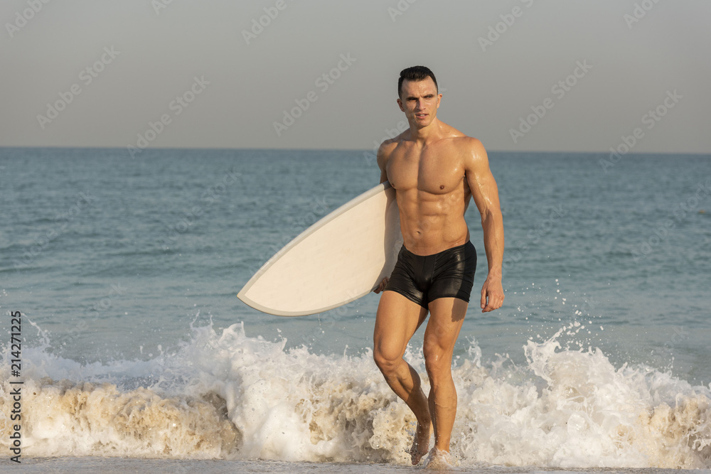 Handsome muscular athletic white caucasian male smiling showing six