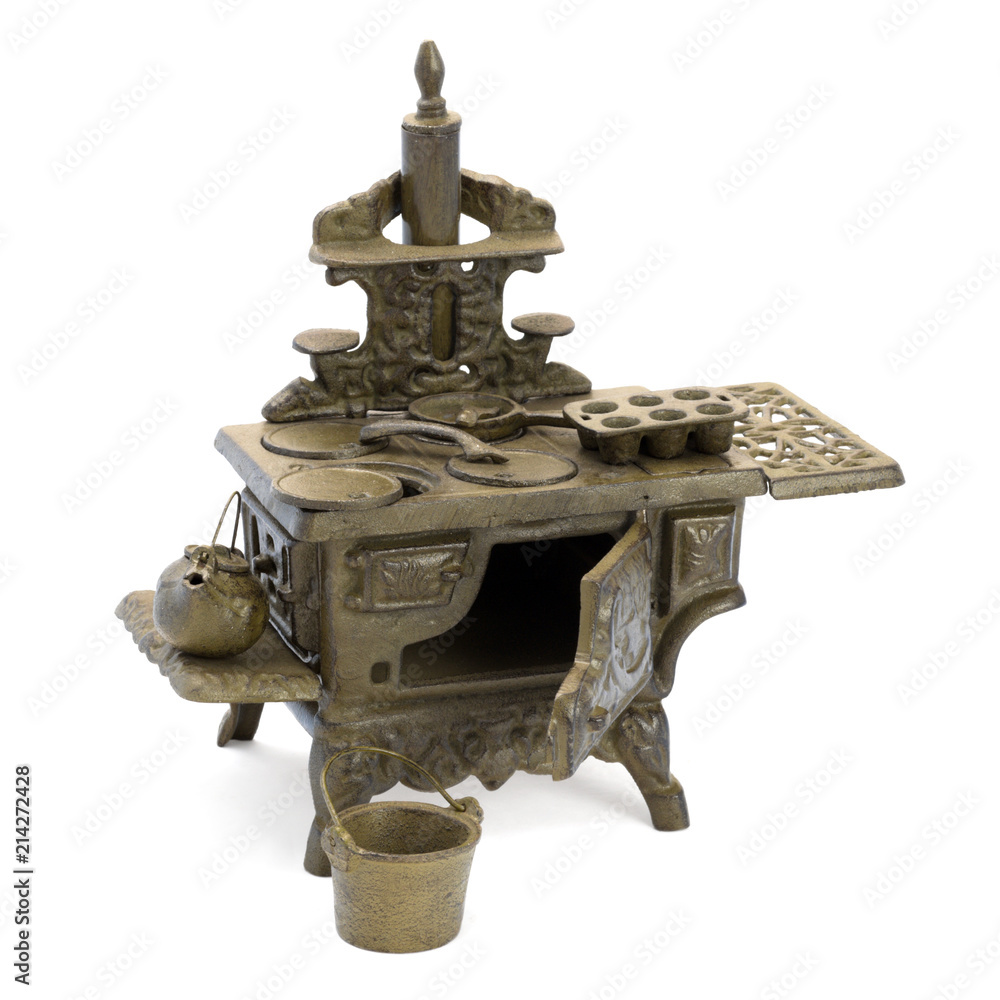Antique children's kitchen with dishes. Antique children's kitchen with dishes.