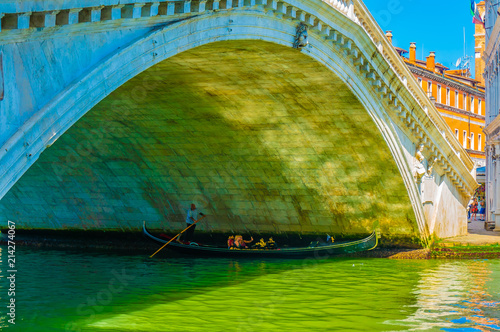 Gondola Under Rialto Bridge in Venice, Italy