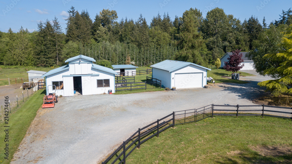 Drone view of the farm yard with barn, garage. Drone view of the farm yard with barn, garage.