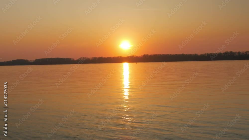 amazing vivid sunset over river in spring time, solar path amazing vivid sunset over river in spring time, solar path