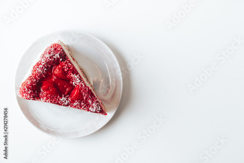 Strawberry cake top view on a white background. High key